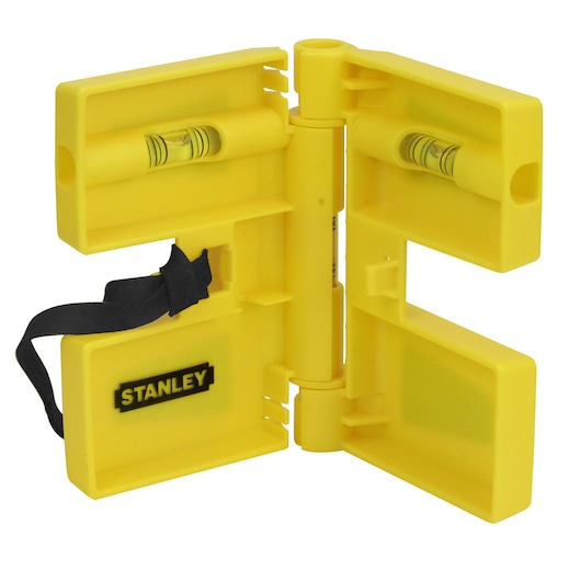 Yellow Stanley corner spirit level with two vials and a hinge, used for accurate measurements in photography setups.