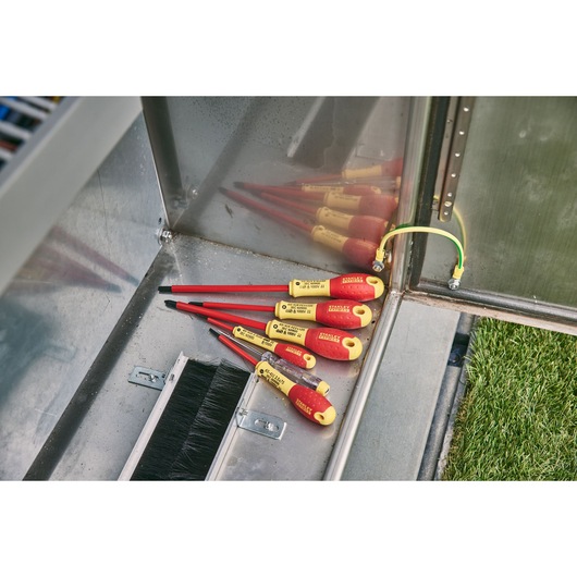 STANLEY 0-65-443 insulated screwdrivers with yellow-red handles, angled view in a metal toolbox.