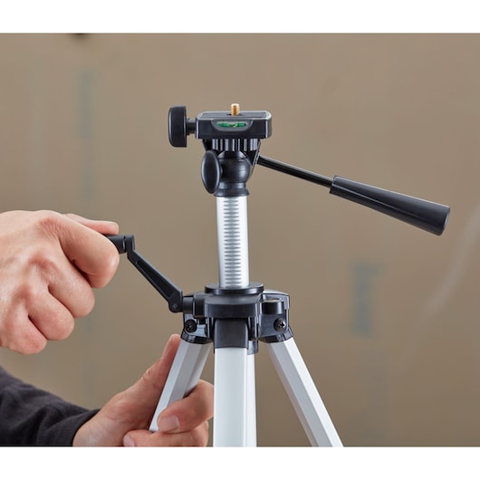STANLEY 1-77-201 photography tripod with adjustable handle and level, shown from a close-up angle.