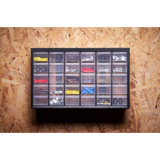 STANLEY 1-93-980 organizer with 24 clear drawers holding assorted hardware, wall mounted front view.