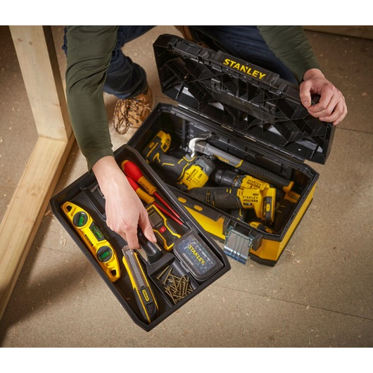 STANLEY 1-95-612 toolbox filled with hand tools and power tools, photography from above.