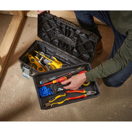 STANLEY 1-95-618 toolbox with assorted hand tools and accessories, top view indoor photography