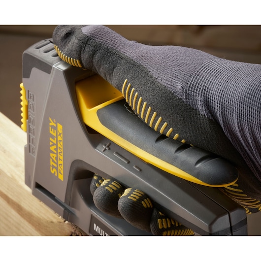 Photo of STANLEY FMHT6-70868 hand-held stapler in use, close-up angle, grey and yellow design.
