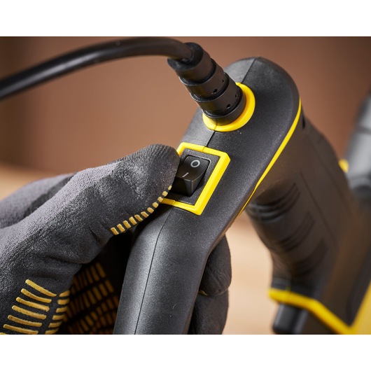 STANLEY FMHT6-75934 hand tool close-up showing power switch and cable with glove.