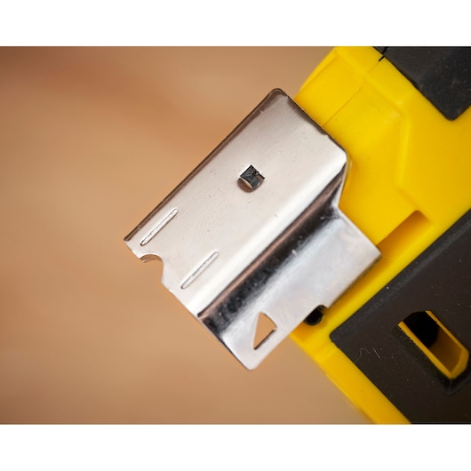 Photo of STANLEY FMHT6-75934 staple gun metal tip, yellow and black plastic housing, close-up angle.