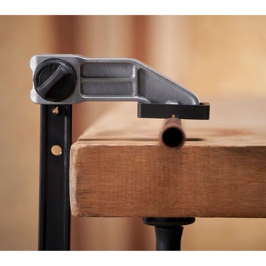 STANLEY FMHT83007-0 photography of pipe cutting tool clamped on wooden workbench, front angle.