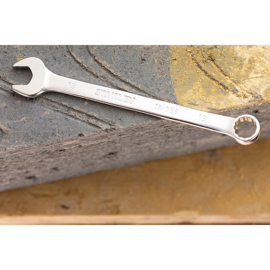 Stanley FMMT13040-0 wrench with open and box ends, silver finish, shown on textured stone surface.