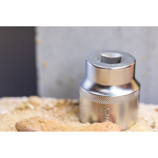 STANLEY FMMT17243-0 chrome socket photography on a sandy surface, close-up view.