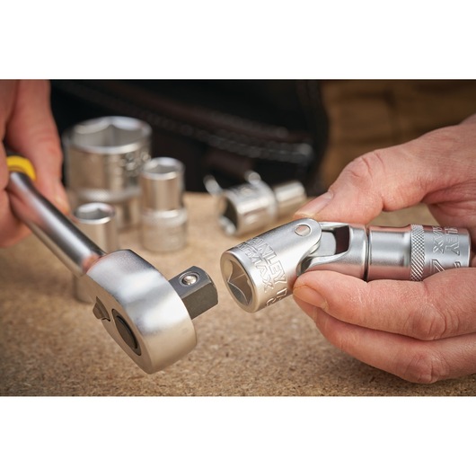 STANLEY FMMT17999-0 socket and ratchet set in use, close-up photo on work surface.