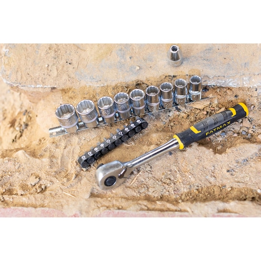 STANLEY FMMT82681-0 socket wrench set with ratchet and sockets on sandy surface, FatMax branding visible.