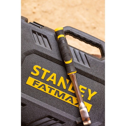 STANLEY FMMT82826-1 hand tool with black and yellow handle on STANLEY FATMAX case, angled top view.