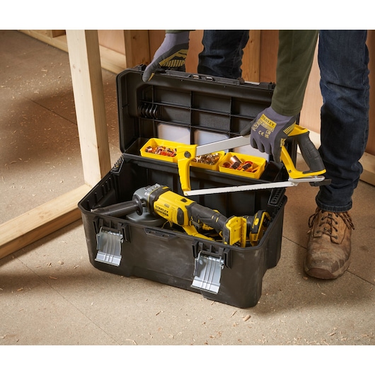STANLEY FMST1-75792 black toolbox with metal latches, shown open with tools and accessories inside, photography at angle.
