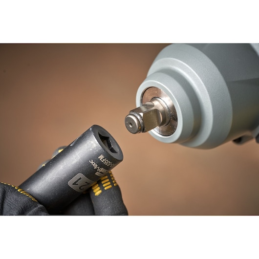 Photo of STANLEY SFMCF940B impact wrench close-up with socket attachment held by gloved hand.