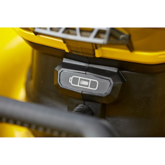 STANLEY SFMCMS2653B close-up of battery indicator on yellow power tool, front angle.