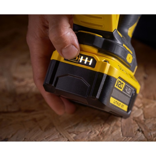 Photo of STANLEY SFMCS650M2K 18V FATMAX V20 Brushless Jigsaw battery indicator being pressed close-up.
