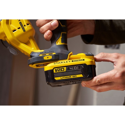 Photo of STANLEY SFMCS650M2K V20 FATMAX brushless jigsaw with 4.0Ah lithium ion battery, close-up view.