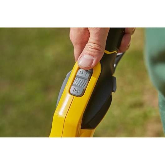 STANLEY SFMCSTB963B power tool close-up showing yellow handle with gray HI/LO switch.