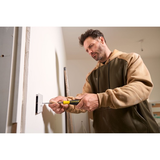 Photo of STANLEY STHT0-60358 screwdriver in use to install an electrical outlet.
