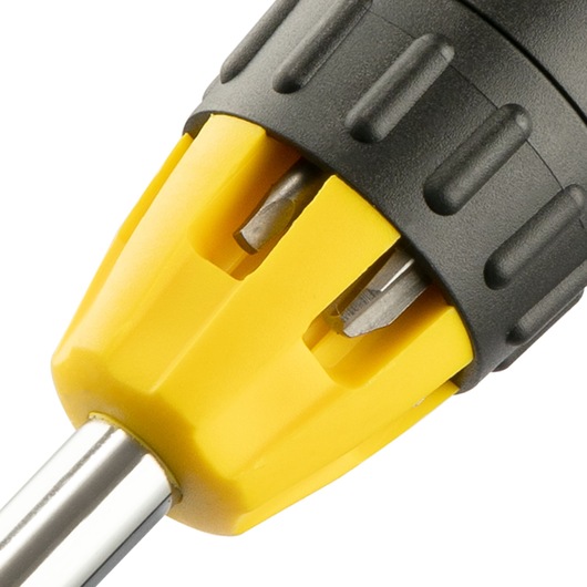 Close-up of a yellow and black STANLEY screwdriver handle with interchangeable bits visible.