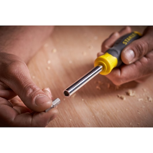 STANLEY STHT0-70885 screwdriver handle and bit shown close-up on wood surface.
