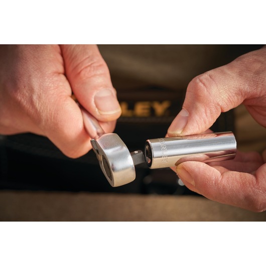 STANLEY STMT86097-0 socket and ratchet tool being held in hands, close-up photography.