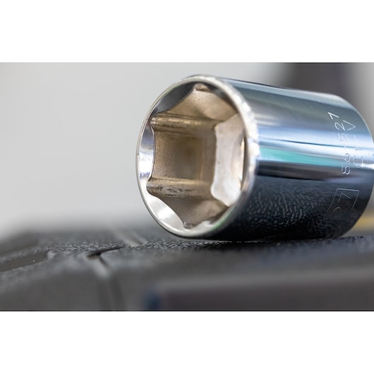 STANLEY STMT86109-0 chrome socket tool, close-up side view, shown on black textured surface.