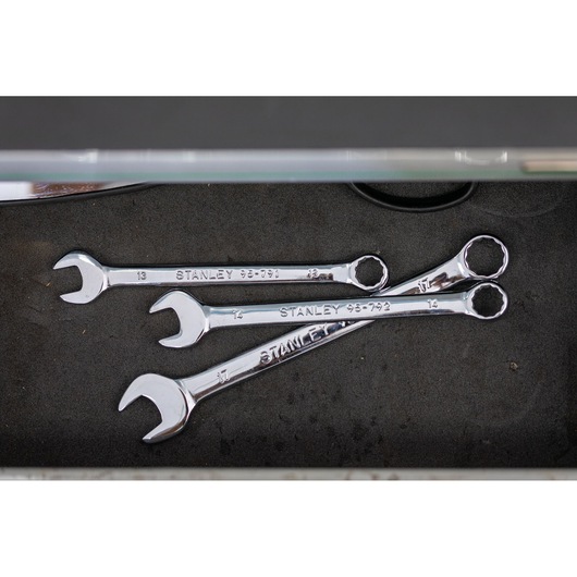 STANLEY STMT95793-0 chrome combination wrenches set in a drawer, overhead angle, photography product.