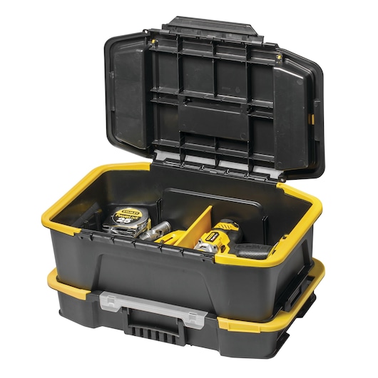 Stanley black and yellow toolbox with open lid, containing tools like a tape measure and drill.