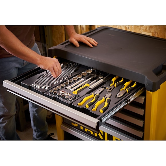 Photo of STANLEY STST74306-1 tool chest with organized wrenches, pliers, and sockets in open drawer.