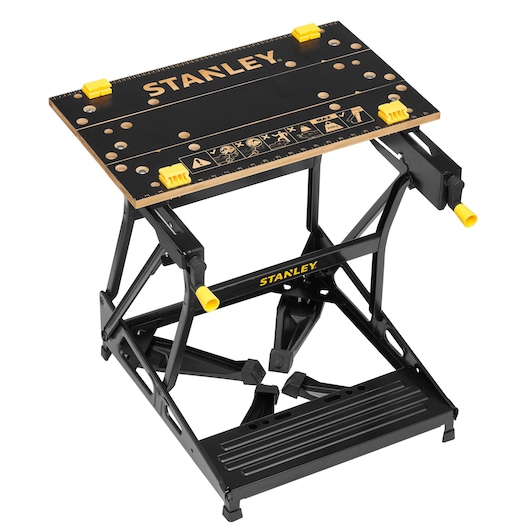 Photo of STANLEY STST83400-1 folding workbench with black and yellow details, angled view on white background.